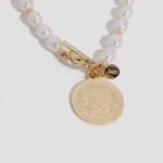 Enhance your baby girl's delicate beauty with our exquisite pearl bracelets. Handcrafted using genuine pearls, these timeless accessories exude elegance and grace, perfect for special occasions or everyday wear.