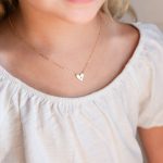 Adorn your little princess with our exquisite baby girl necklaces. Crafted from hypoallergenic materials, these dainty, yet durable pieces feature charming designs, delicate colors, and adjustable lengths, ensuring both safety and style for your precious one.